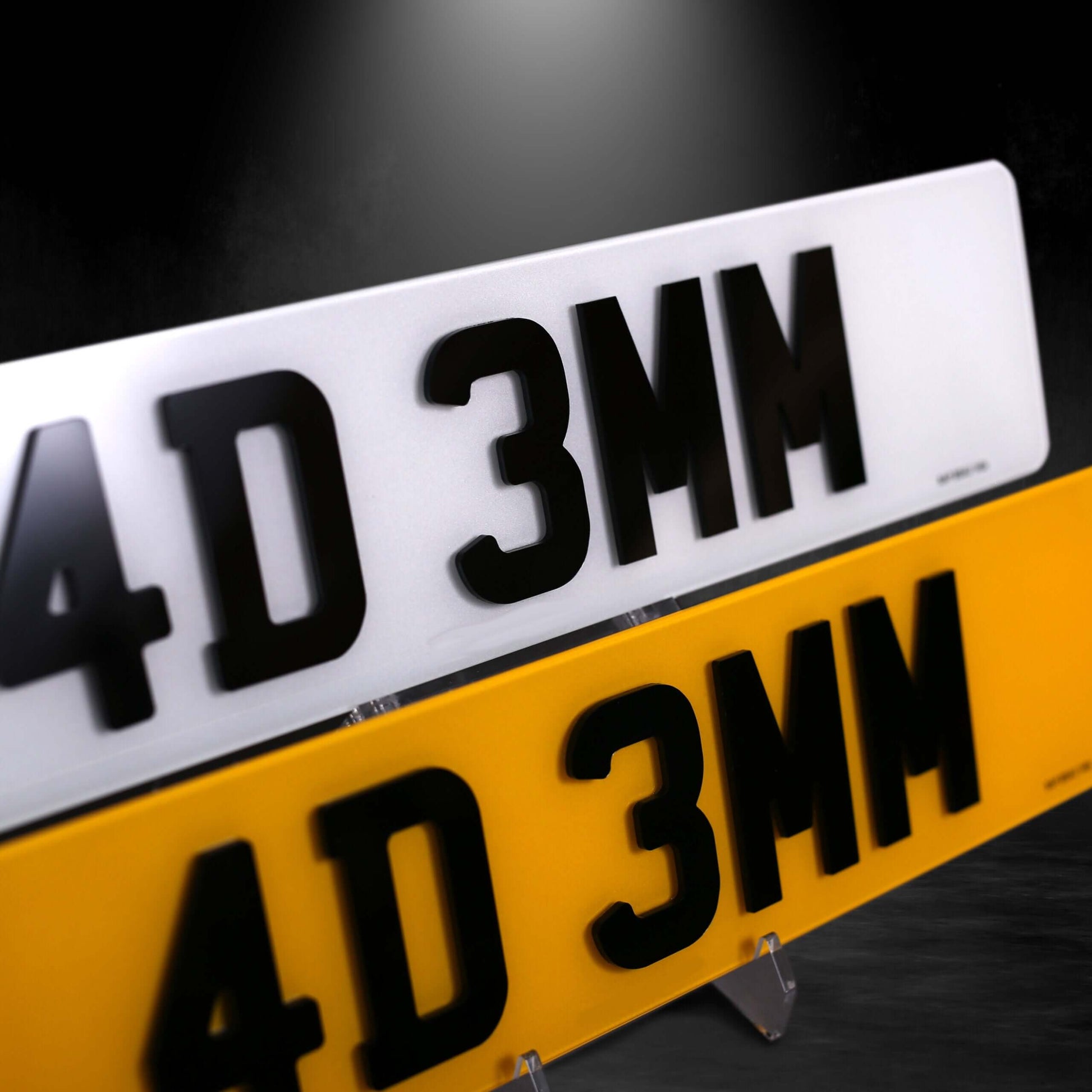 Pair of 4D 3mm car plates in yellow and white, showcasing laser-cut digits for enhanced style.